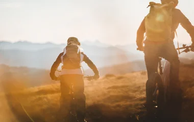 2 people biking