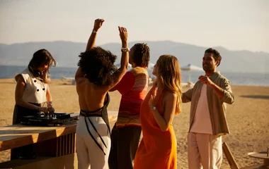 people dancing on the beach, new years