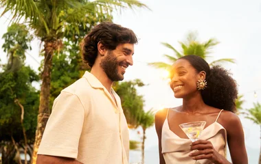 A beach with turquoise water and palm trees