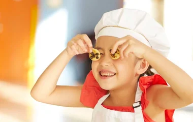 Little girl holding a cookie