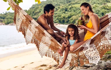 Family on a hammock on the beach