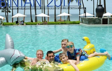 Family having fun in a pool