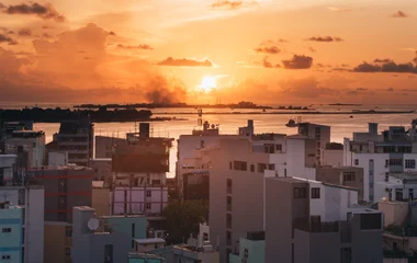 View of the city of Male during sunset
