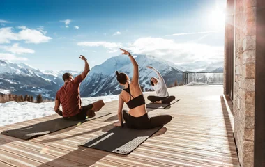 A beach with turquoise water and palm trees