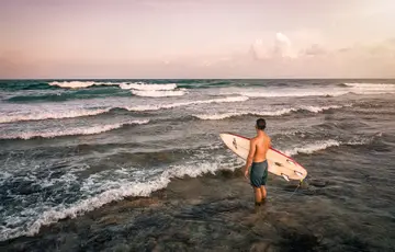 Man surfing in the Indian Ocean