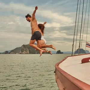 people jumping in water