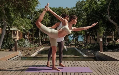 Couple doing yoga lesson in club med malaysia resort