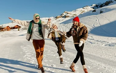 family playing in snow at club med resort