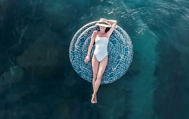 woman on float in club med beach