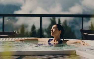 A woman is relaxing in a private pool in Club Med wellness package
