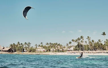 A man enjoying kite surfing outdoor watersport in Club Med Resort