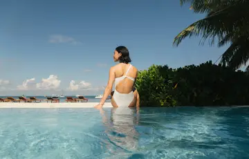 woman by the pool on an island