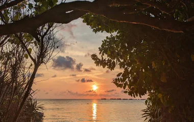 sunset on the beach in indonesia