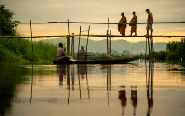 thailandese monk on the river