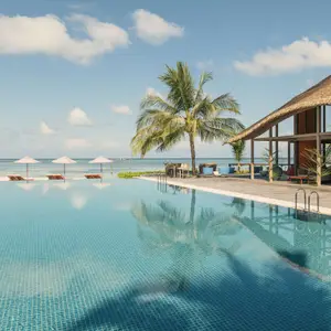 Dive into the vibrant underwater world of the Indian Ocean, unwind on pristine white-sand beaches, and indulge in gourmet dining at Club Med Finolhu Villas, Maldives