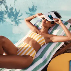 Woman on holiday by the pool