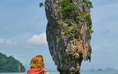 a backpacker sitting in Phang Nga Bay