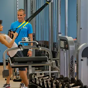 lady in the gym with a trainer
