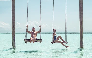 Couple on an overwater swing