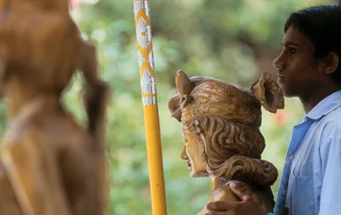 Male worker with cultural statue