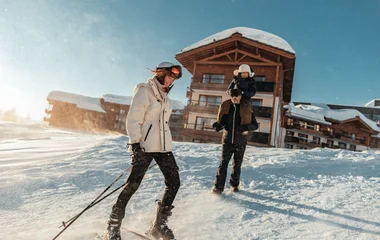 family skiing in the Alps