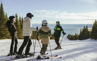 Skiers overlooking views of Quebec in Canada