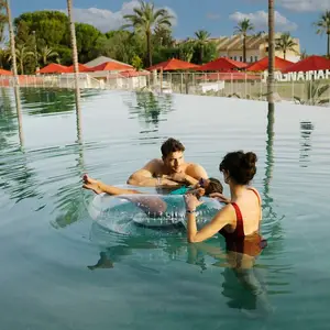 Family in the pool in a resort in Marbella