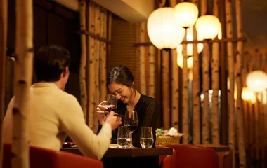 Couple having dinner in a ski resort in Japan