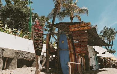 surf boards on a beach in Canggu