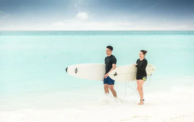 Surfers in the Maldives