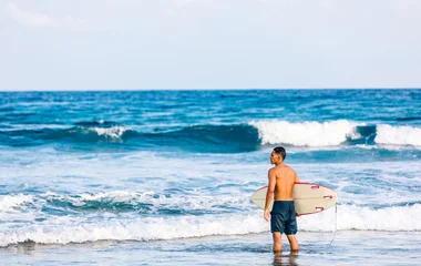 Surfer in the Maldives