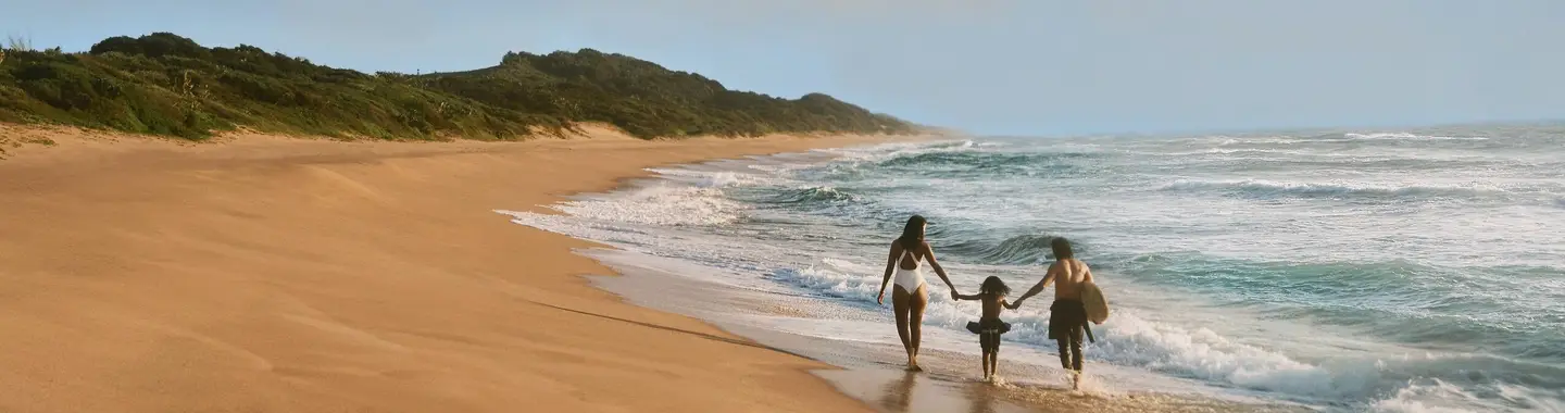 A family on holiday on the beach