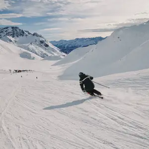Man skiing on the slopes in the Alps