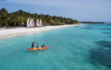 family kayaking at Club Med Kani