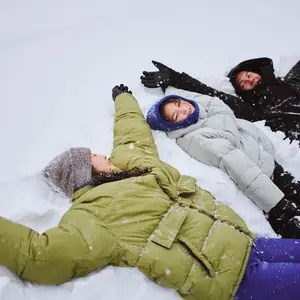 Family playing in snow.