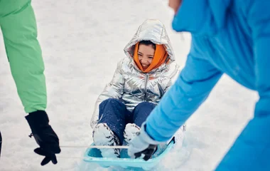Kid on a sled.