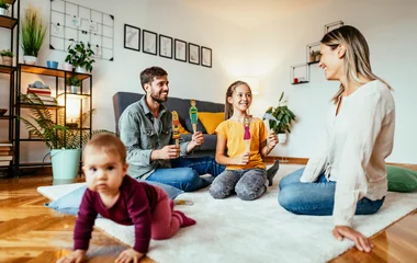 Family in the room with baby.